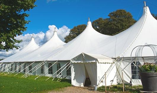 spacious blue portable restrooms organized at a fairground, allowing for comfortable use by individuals of all ages in White Hall WV